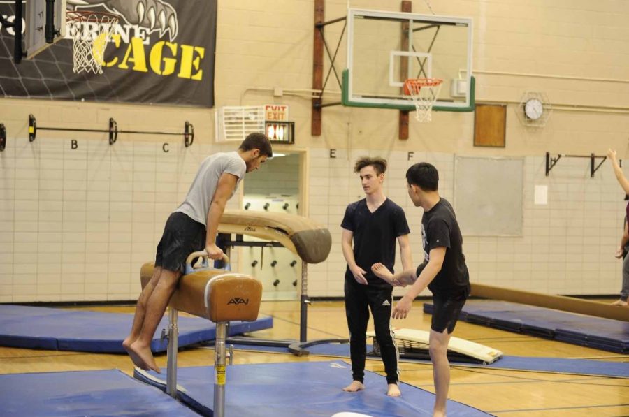 During team practice with the Boys' Varsity Gymnastics team, John Kabbani ‘17 works on technique with the pommel horse..