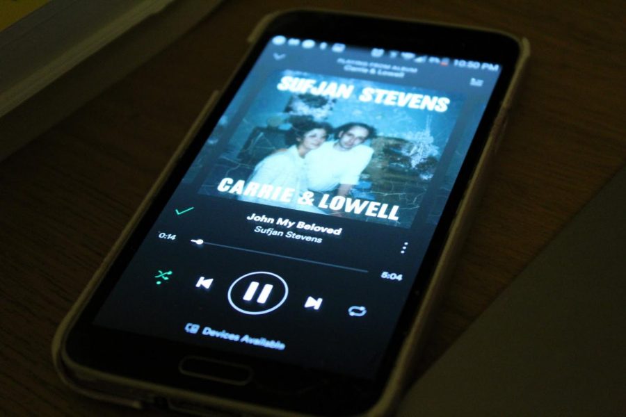 A phone plays the track “John My Beloved” off of the album ‘Carrie & Lowell.’