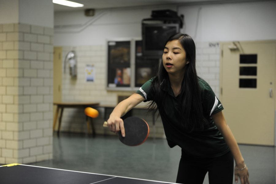 Athena Ding 19 focusing on the table tennis game