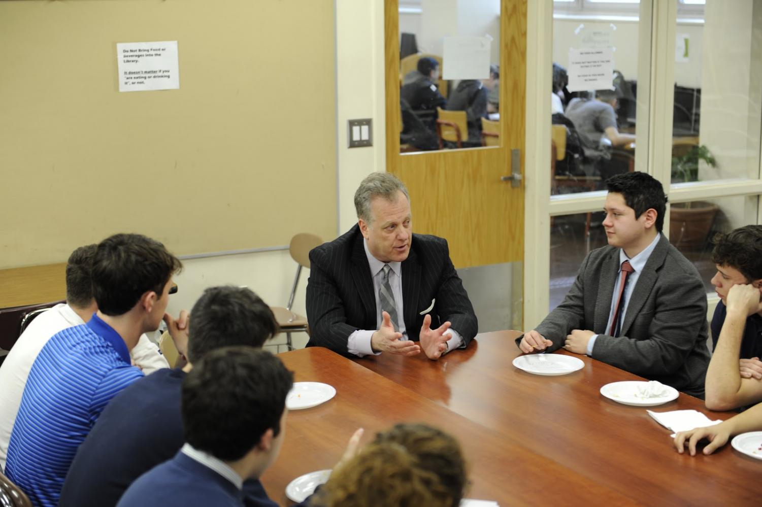 Michael Kay speaks to students about his experiences at Bronx Science during a luncheon.