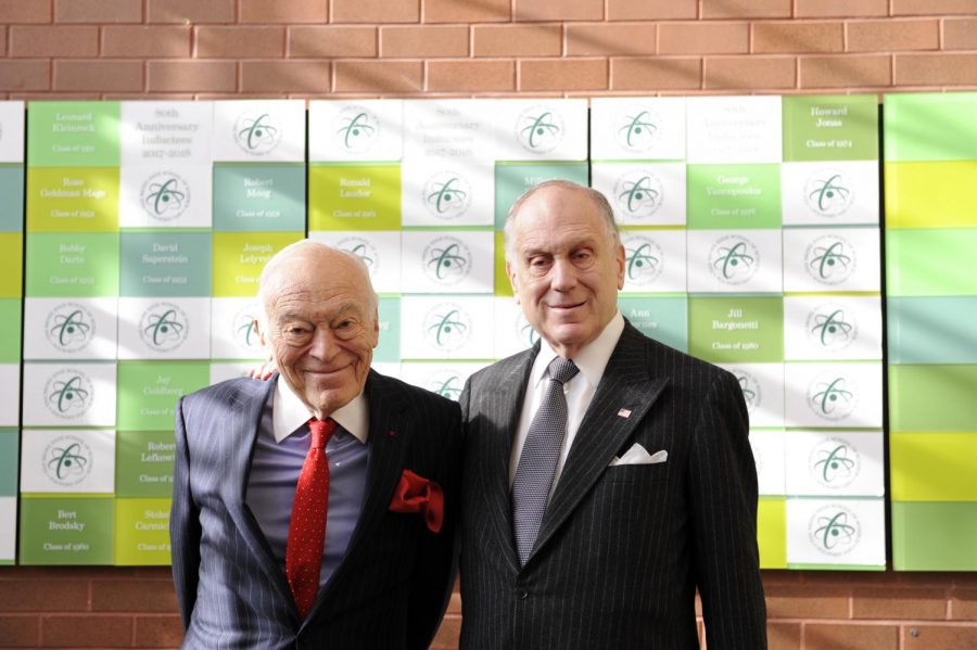  The Lauder brothers pose in front of the Bronx Science Hall of Fame 
following their formal induction.