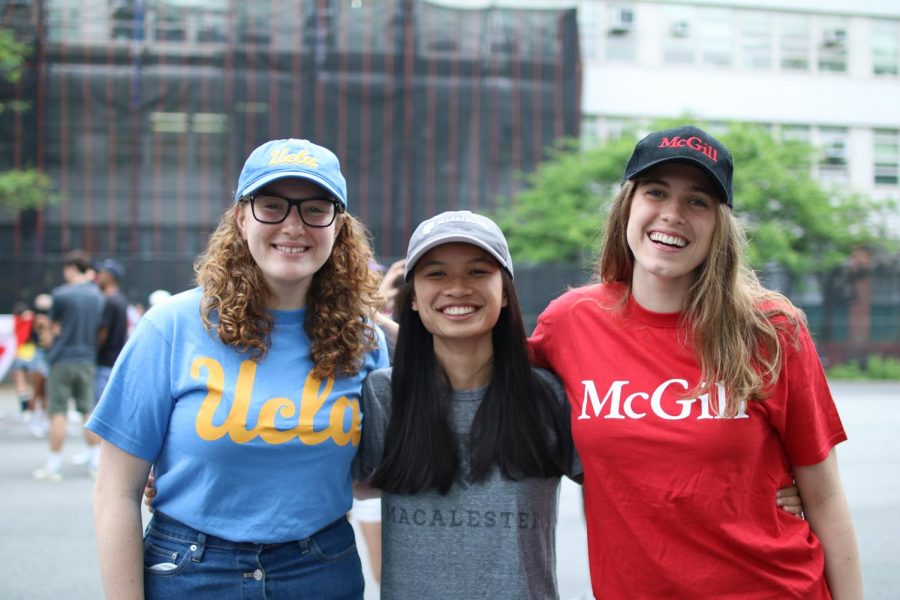 Seniors Fiona Sullivan, Anna Leidner, and Georgia McKay wear their college t-shirts and hats to participate in College Apparel Day.