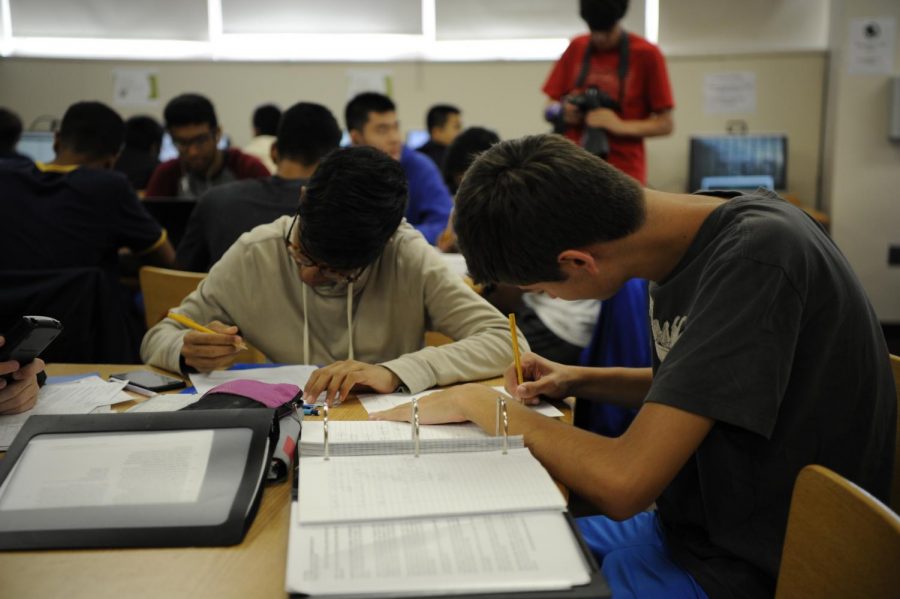 Students study together in the Bronx Science library, preparing for the SAT.