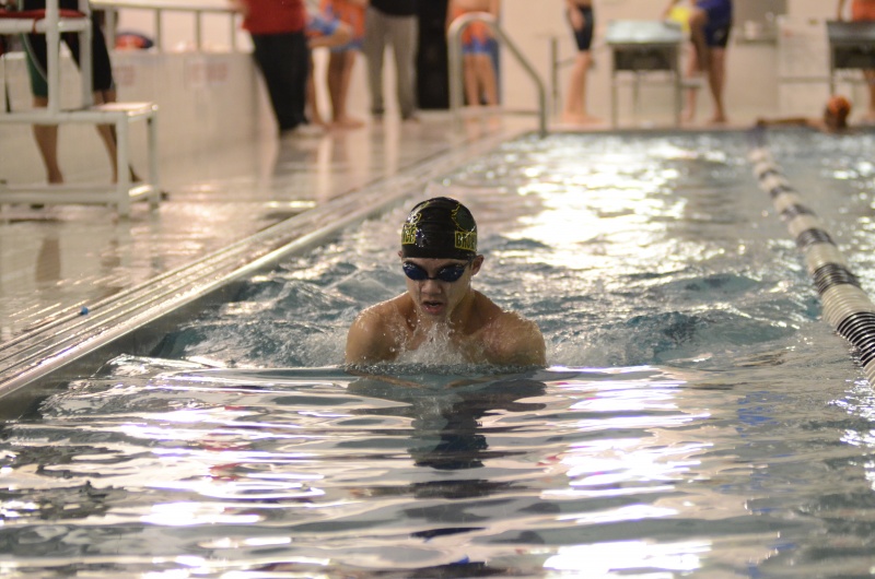 Ethan Tan ’20, afloat, prepares to dive right back into the water.