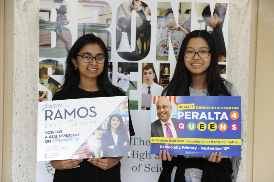 Tashfia Haidar ‘19 (left) & Joy Lin ‘19 (right) holding campaign posters of victorious insurgent Jessica Ramos & incumbent IDC member Jose Peralta