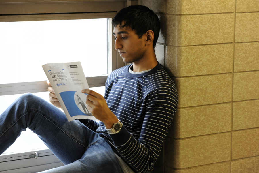 Tejpal (Phillip) Ramdas 19 reads the Advanced Placement Bulletin packet for more information on the upcoming A.P. exams.