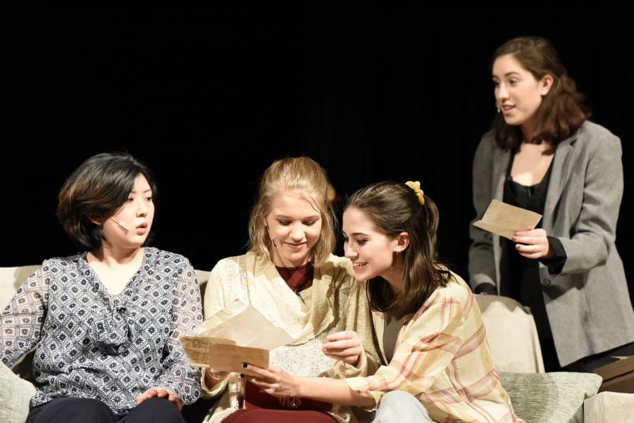 Sala, played by Jing Mae Wang 20, shows her family (left to right: Candace McQuaig 20, Caroline Gallagher 19, and Ava Vercesi 19) her old letters.