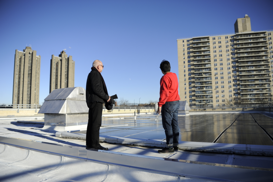 Assistant Principal Mr. Kalin (left) and Archit Kothari ’19 (right) discuss the solar energy benefits of the 146 solar panels on Bronx Science’s roof.
