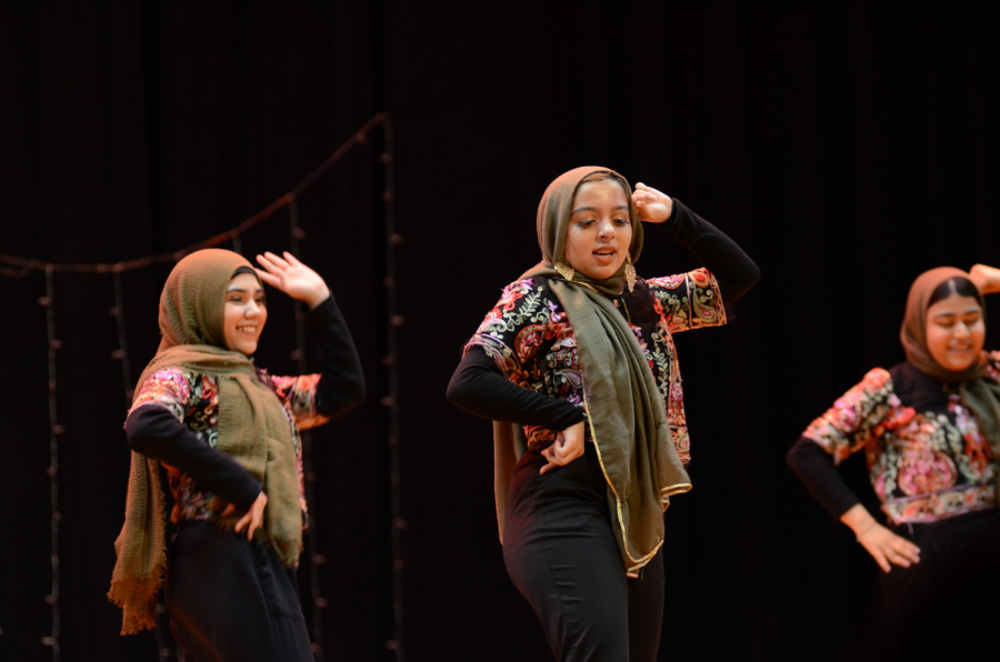 Momina Begum ’19, Naima Nadia ’19  and   Fatema Kamal ’19 show off their dance during the Nasha Show.
