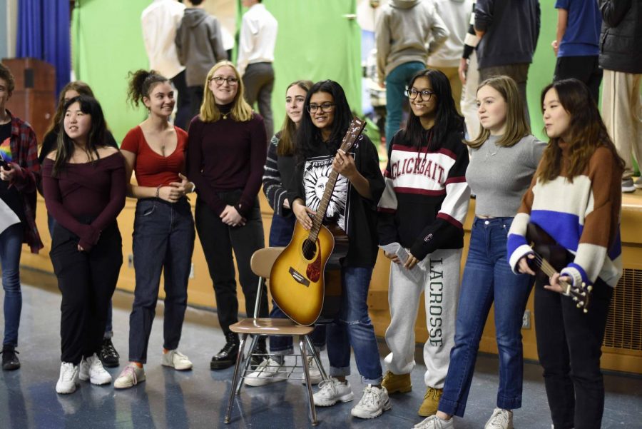 Carolers from Bronx Science’s Chorus spread the holiday spirit by performing festive songs for their peers. 