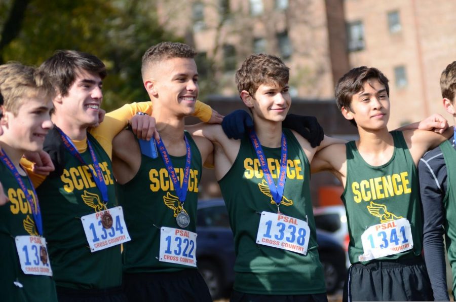 The varsity team lines up with their medals after claiming the PSAL championship title. “We knew we could win if we ran well, and we didnt want to let ourselves down,” said Wyatt Morgan ’20.


