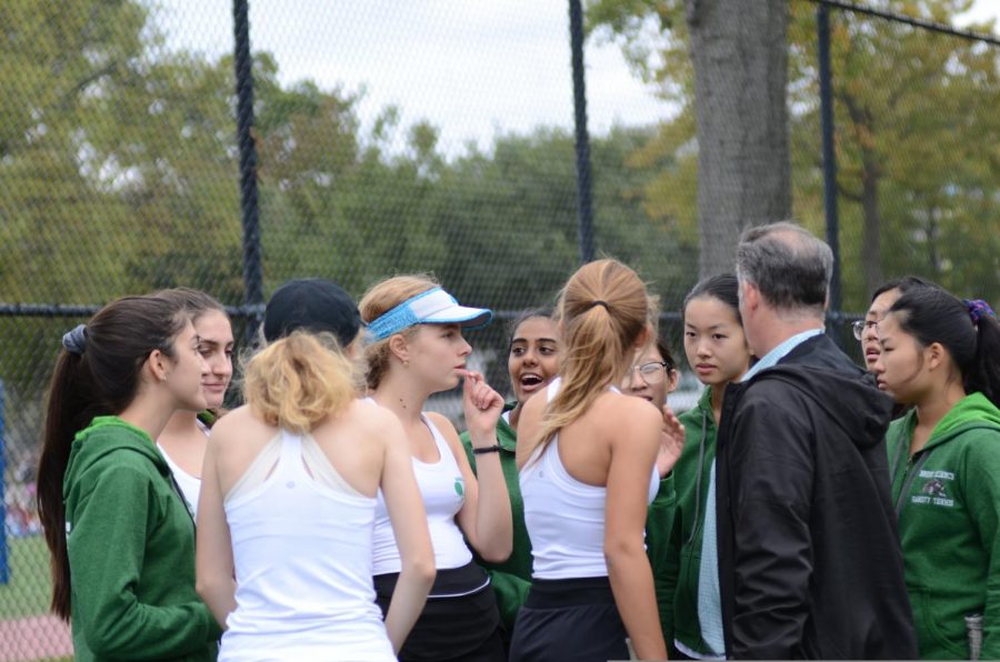 The Tennis Girls Varsity Team have fun after a game. 