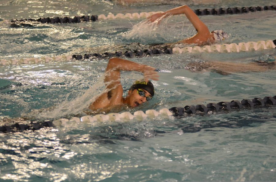 
Varsity Swimming players compete in the pool during a meet.