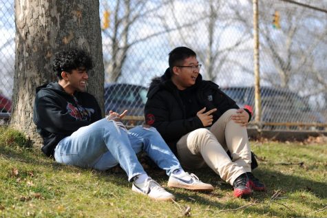 Sabin Alam 20 and Hanil Chung 20 laugh together in the Bronx Science courtyard, sharing a moment of levity during their lunch period. 