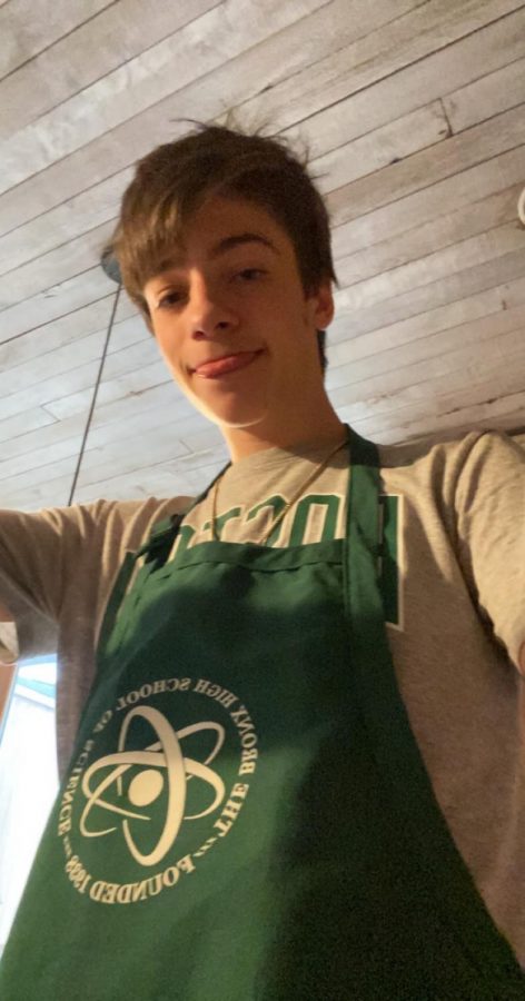 Kieran Aug ’20 wears a Bronx Science apron.