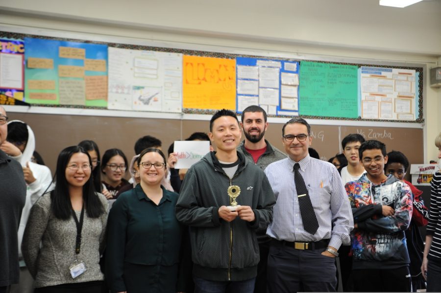 This photograph, taken  earlier in the academic year, shows Mr. Liang winning the rap battle that he had with physics teacher Mr. Blake. Ms. Li and Ms. Costanzo are there as well. In the karaoke sessions, Mr. Liang does rap, which is another reason why these karaokes are so great. The Mathematics teachers are happy to show off their musical talent, whether it is through their singing, guitar playing, or by rapping. 