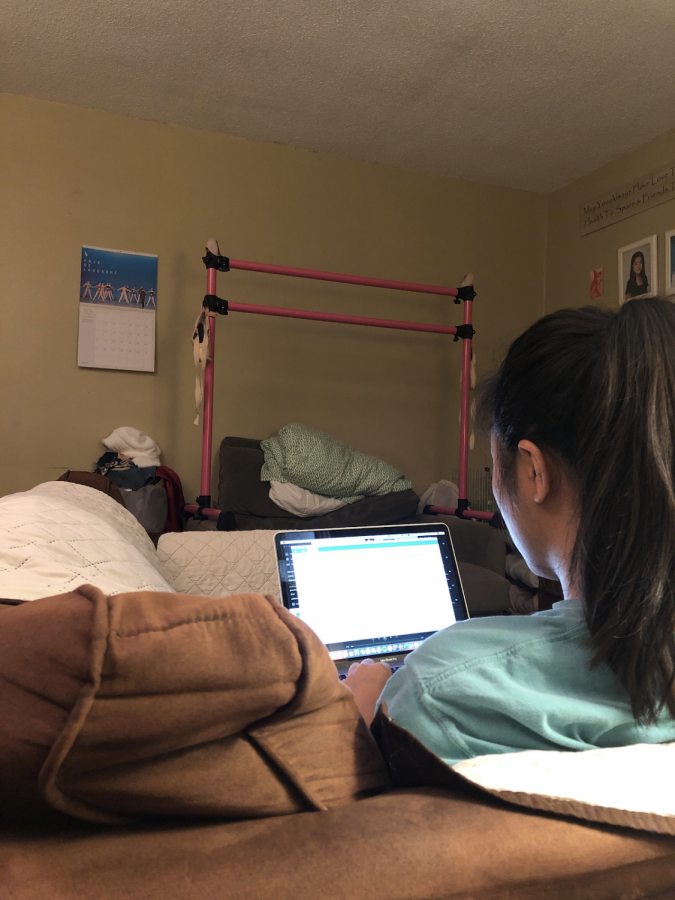 Emma Nguyen ’21 conducts her science research for the Regeneron Science Talent Search at home, due to the Coronavirus pandemic. 