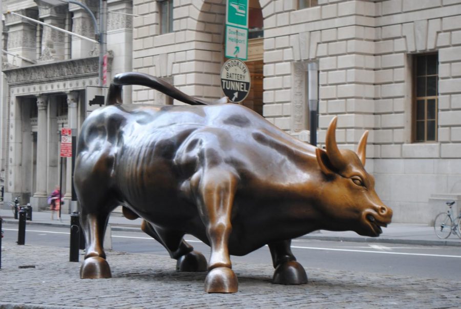 Wall+Street%E2%80%99s+iconic+Charging+Bull+statue+is+a+symbol%2C+among+other+things%2C+of+strong+American+economics+and+politics%2C+yet+this+sculpture+representing+rising+financial+markets+is+currently+in+the+backdrop+of+economic+downturn+for+many+Americans.+
