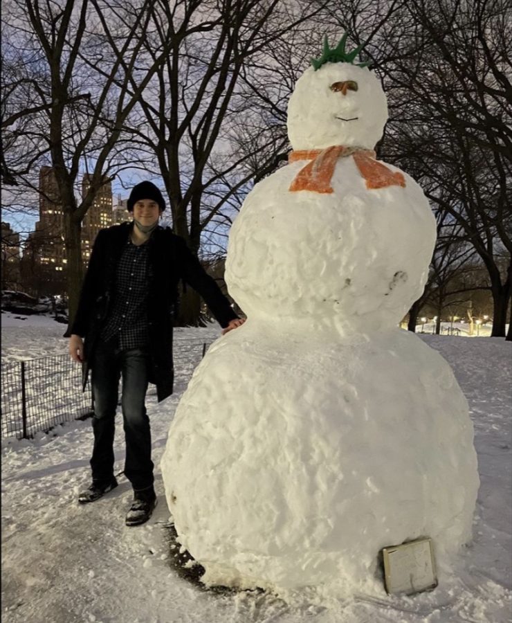 Wyatt+Smith+after+building+his+snowman+on+the+night+of+February+1st%2C+2021.+The+city+shines+brightest+when+its+snowing+like+this.+You+can+just+feel+a+noticeable+level+of+joy+in+the+air%2C+he+said.