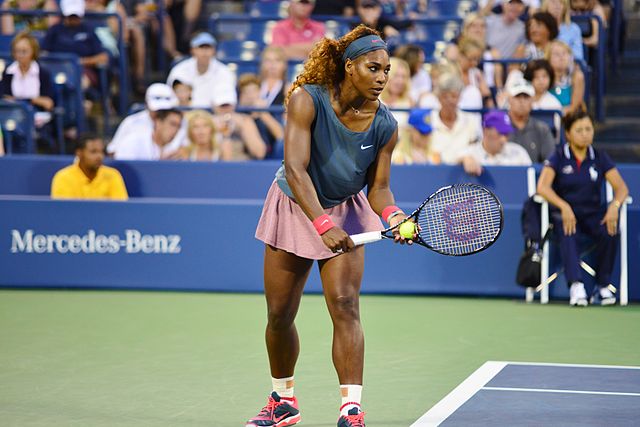 Serena Williams prepares to serve during 2013 U.S. Open. Williams competitive nature has helped her to play her best on the court, but it has also added pressure on her to achieve and to break world records, which may affect her performance. 