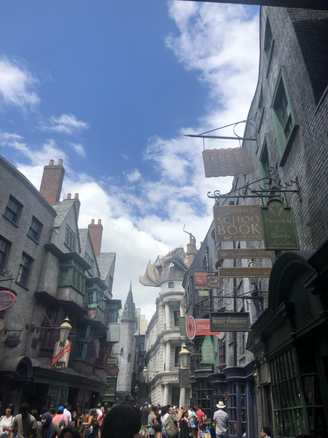 Media companies, like Universal Studios and Disney, extend cherished narratives by creating amusement parks for fans to visit and immerse themselves in the culture of their favorite stories. Pictured is the recreation of the Harry Potter movie franchise’s Diagon Alley at Universal Studios Florida. Visitors embody a wizard with purchased wands and cloaks, dine in iconic restaurants, and go on adventures with familiar characters.