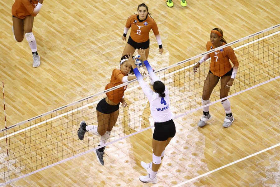 Mid-point and mid-air, Kentucky outside hitter Madi Skinner goes up for a solo-stuff-block on Texas outside hitter Skylar Fields, who hits out of serve receive on Texas’ right side. Skinner posted an astounding 0.455 hitting percentage in the NCAA Final match between Texas and Kentucky - greater than any of the Longhorns’ hitting percentages.