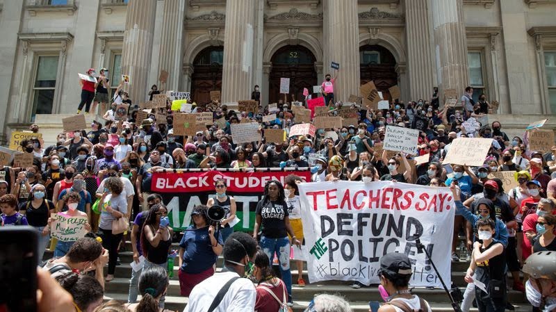 The scene at the a Police-free schools rally on June 6th, 2020, which was located blocks away from the African Burial Ground National Monument in Lower Manhattan, New York. Thousands of students, teachers, and parents came together to protest. The rally was also a place to memorialize George Floyd. People spoke about Floyd at the rally and mentioned the legacy he had left us. 