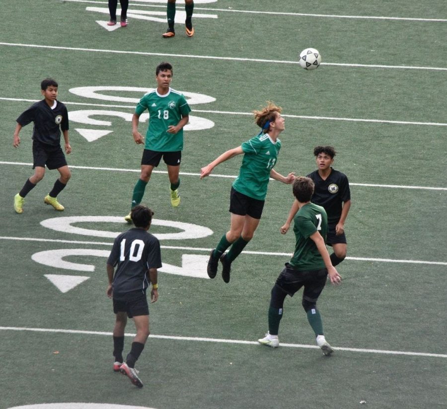 Max Kramer ’22 jumping to win a header. He, as well as three other players, will be graduating this year.