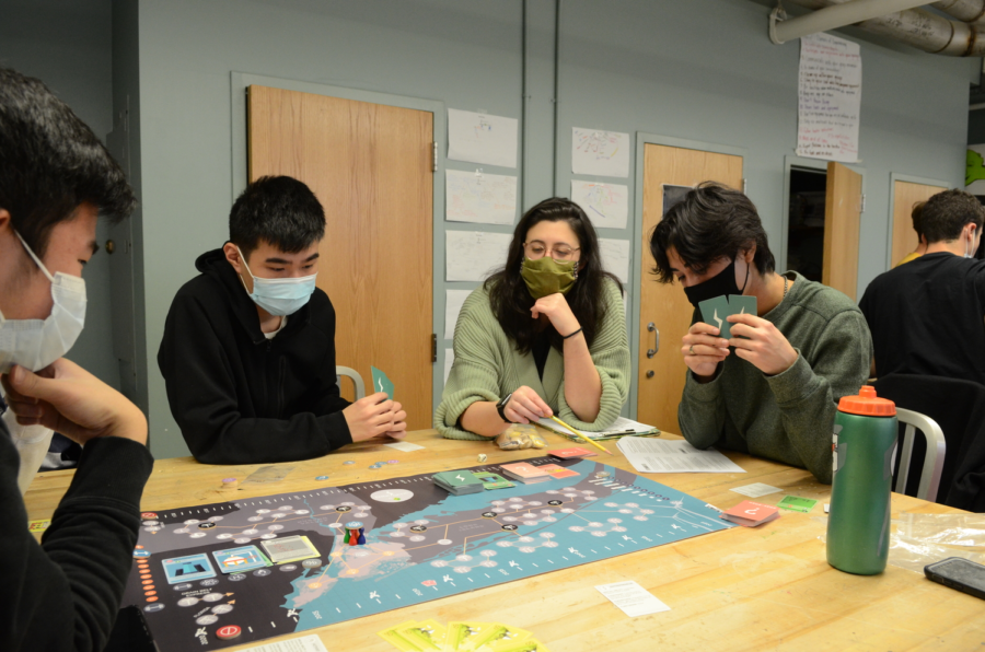 Ms. Wax and students play a game about energy policy in the Green Design and Clean Technology class.
