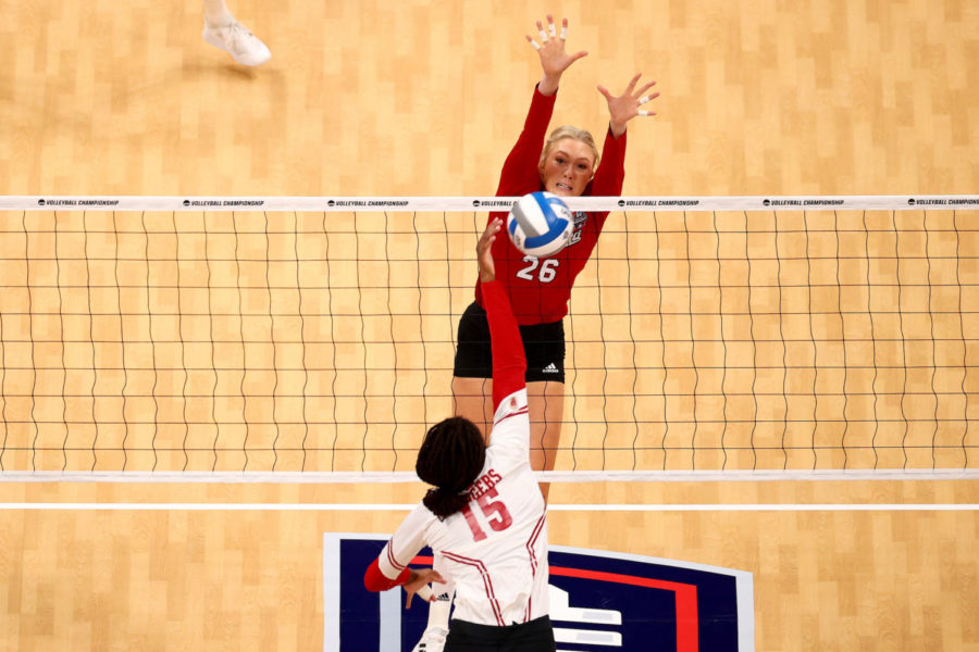 Lauren Stivrins #26 of the Nebraska Cornhuskers jumps for a block against the Wisconsin Badgers during the Division I Womens Volleyball Championship on December 18, 2021 in Columbus, Ohio. (©Jamie Schwaberow/NCAA Photos)