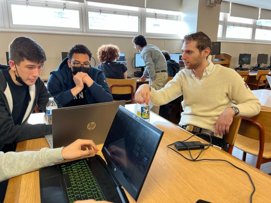 A team at AtomHacks VIII gets help from mentor and Fullstack Web Development Workshop host Harry Shapiro ’14.