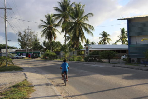 A child rides his bicycle outside of Nauru College through the Island Ring, the nation’s main road. The ring circles the entire island and has a circumference of 17 kilometers.