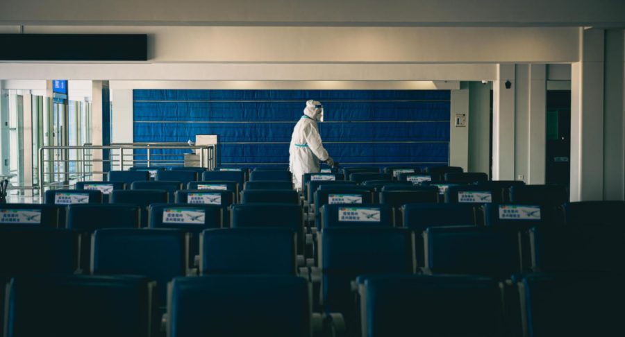 A government worker sanitizes a shut down airport in China.