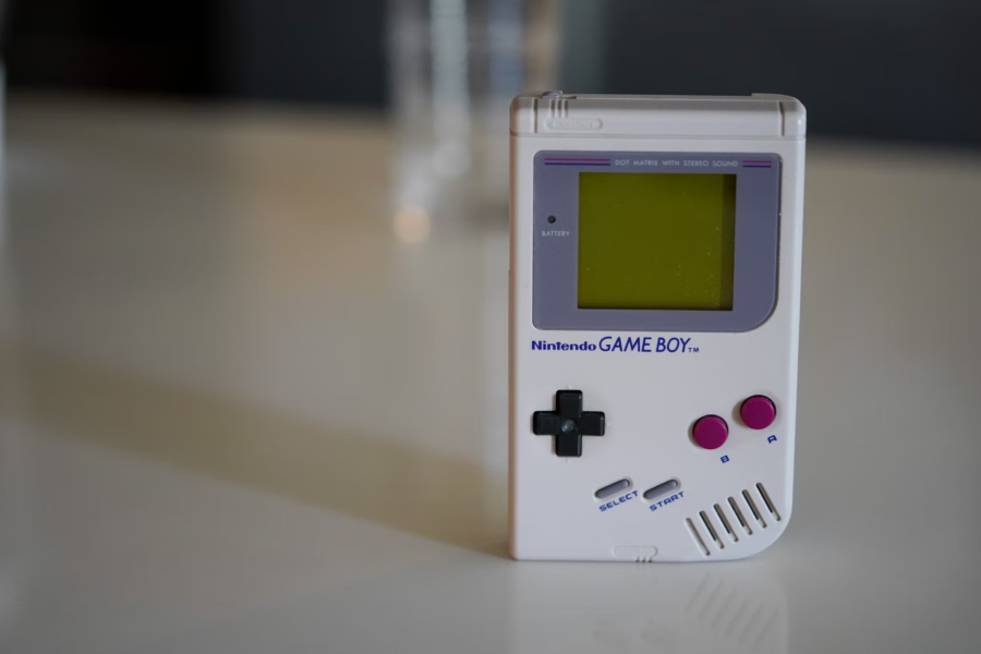 The Game Boy, approximately four inches by six inches, was one of the first handheld video game consoles to be released by Nintendo.