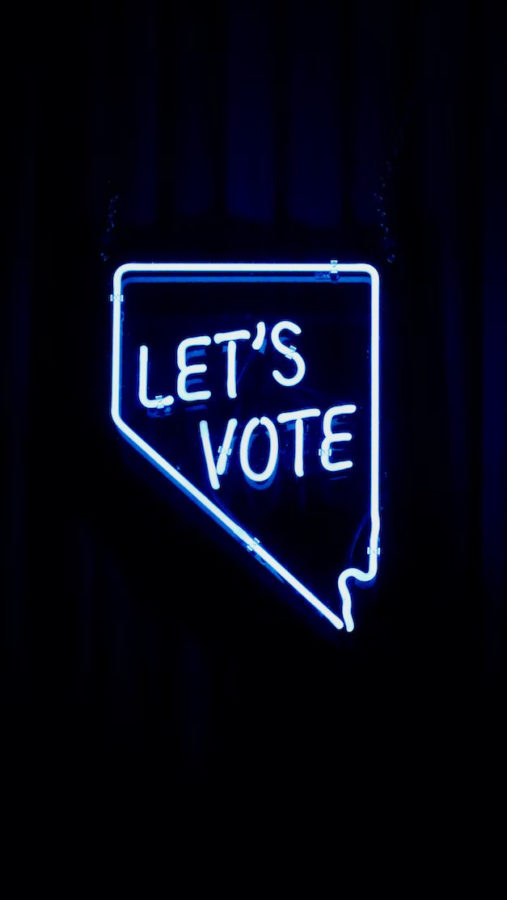 A neon sign encourages Arizona residents to vote

