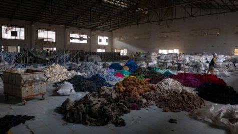 Masses of discarded clothing lie in an abandoned factory in Cambodia.