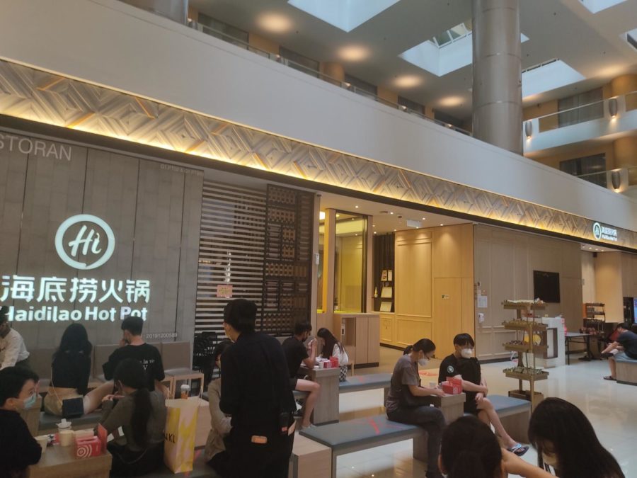 Here is a photo of haidilao, a popular multi chained hot pot restaurant. The logo of the restaurant looks like a hi, as a welcome for people to come in. 