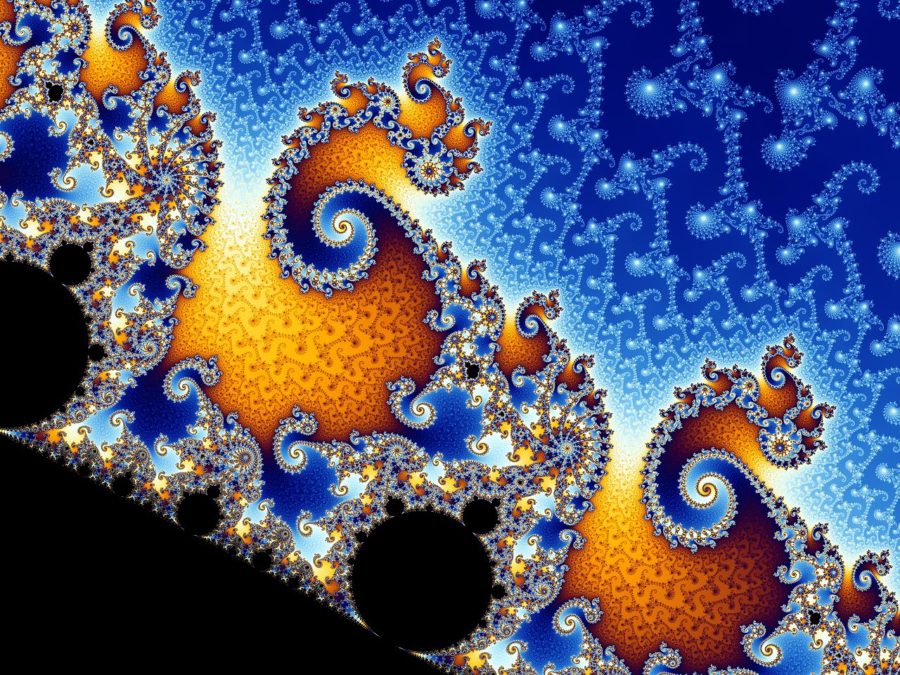 The renowned Mandelbrot set is home to an unending plethora of extravagant details. This section resembles a cluster of galaxies speckling the cosmos.