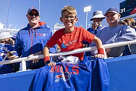 Children receive a once in a lifetime experience sitting in the front row of a Buffalo Bills football game. 
