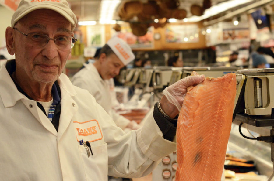 Len Berk has worked as a slicer behind the Zabar’s fish counter since retiring from a job in accounting almost 30 years ago. “We all have regulars behind the counters,” Berk said. “They get used to the way we slice.”