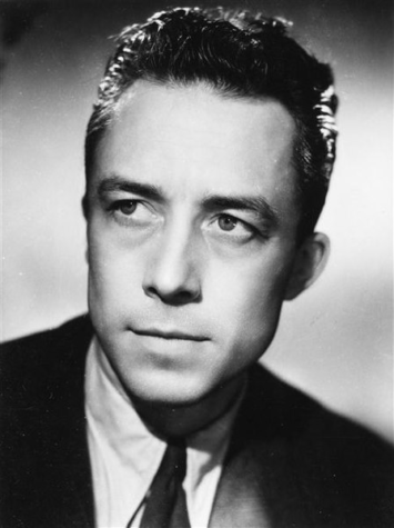 Here is a studio headshot of Albert Camus, taken in 1945.