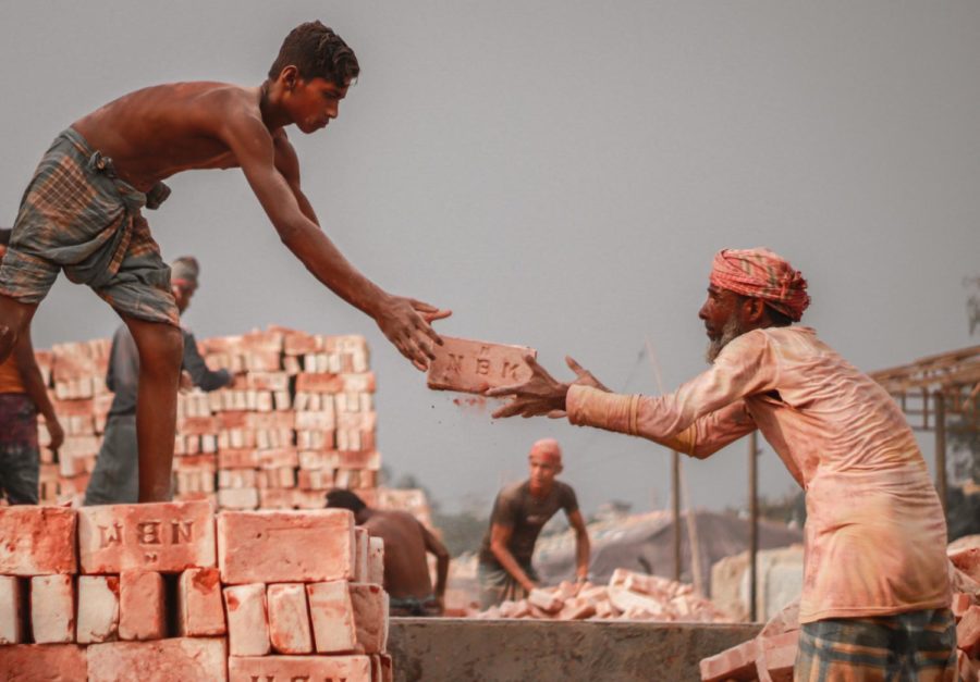 An elderly man and a young man build a part of Bangladesh.
(https://unsplash.com/photos/D8KUJbEc3cQ)