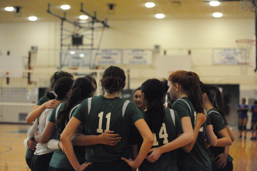 Time-out huddles are common in many sports. In volleyball, huddles are important to raise moral and discuss strategy. 