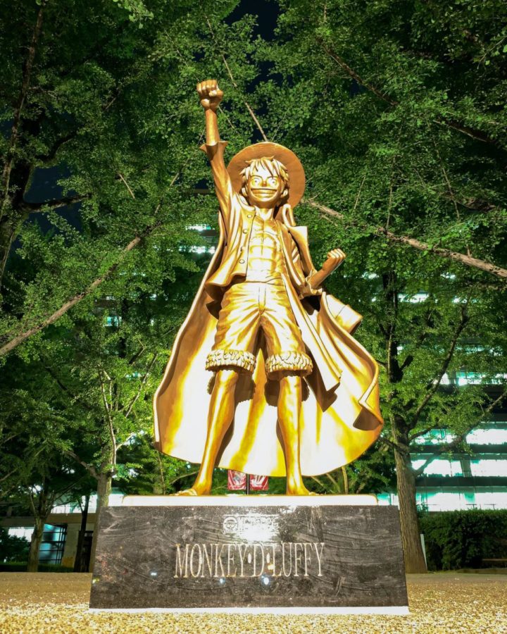 Here+is+agolden+statue+of+Monkey+D+Luffy%2C+the+main+character+of+One+Piece%2C+located+in+Chuo%2C+Kumamoto%2C+Japan.+