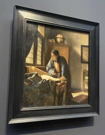 'The Geographer' exemplifies classic Vermeer features including open windows, slanting light from the side, and tables in the foreground.