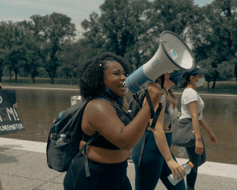 Black feminism encourages women to chant with megaphones and lead crowds instead of marching behind or on the adjoining street.