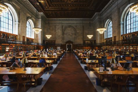 The peaceful atmosphere of the New York Public Library makes it a suitable environment for students to complete their schoolwork.

