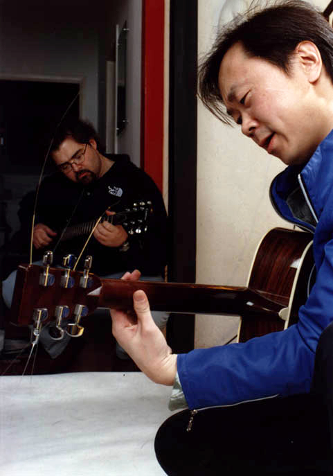 Here is Mr. Matthew Clark, Kemaxiu, playing the guitar with Cui Jian, known as the Father of Chinese Rock Music. (Photo provided by Matthew Clark)