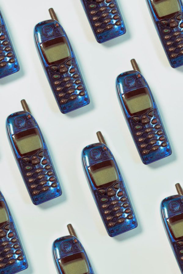 Gen Z’s resurgence of the Y2K aesthetic has led to the popularity of elements reminiscent of the era, such as Nokia cell phones. And while the Y2K aesthetic is certainly back, its return doesn’t come without a modern twist. (Photo Credit: Girl with red hat / Unsplash)