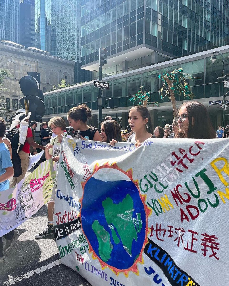 Teenagers from the Sixth Street Community Center’s Teen Climate Justice Program hold a banner and protest at the March to End Fossil Fuels. Over 75,000 protestors filled the streets of midtown Manhattan that Sunday, on September 17th, 2023. (Photo credit: Used by permission of @sixthstreetcc on Instagram)